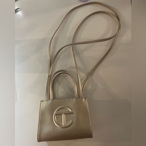 Small Gold Telfar purse. Bought this during the rainbow drop. No dust bag.